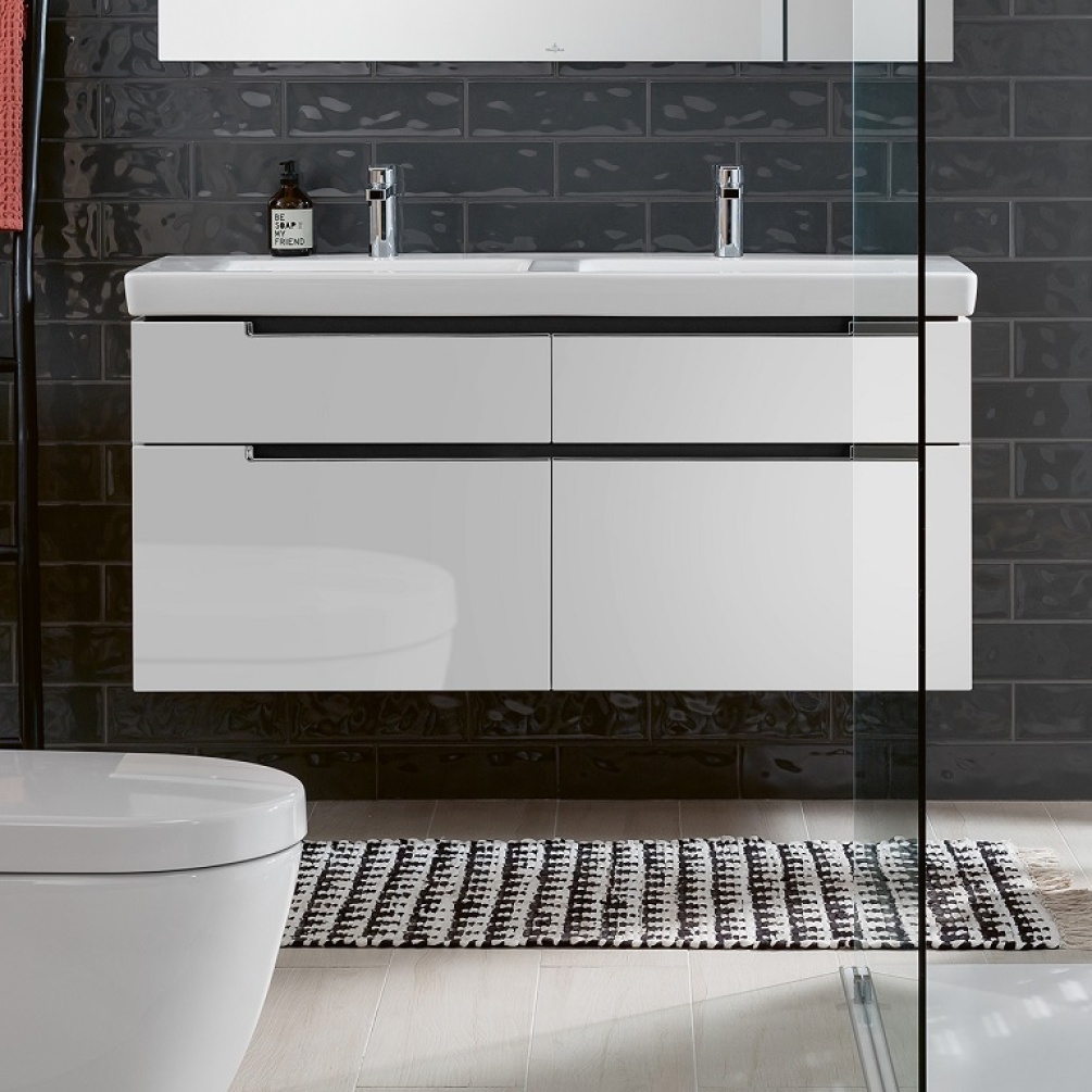 Lifestyle image of Villeroy and Boch Glossy White 1287mm Wide Wall Hung Vanity Unit in Glossy White with Double Basin hanging on grey brick wall A91710DH